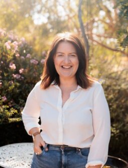 Beck Burgess smiles at the camera.